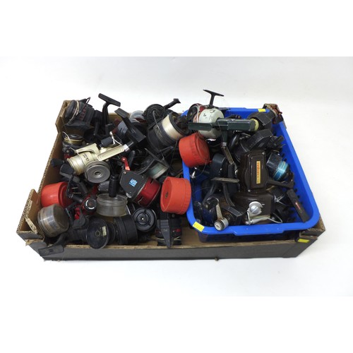 183 - A collection of thirty three spool fishing reels including Shimano Triton Baitrunner, Cardinal 664GT... 