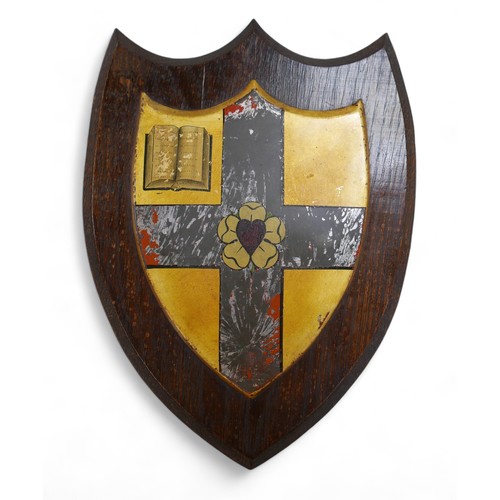 120 - A college library shield on an oak mount, 24cm by 31cm. Ede and Ravenscroft part label verso.