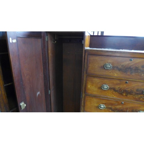 606 - A Victorian mahogany compactum wardrobe, chest centre with five long drawers, flanked by a pair of n... 