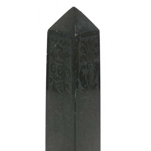 132A - A 19th century slate obelisk, in Grand Tour style, with polished surfaces engraved with foliate and ... 