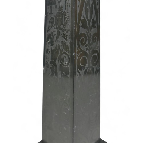 132A - A 19th century slate obelisk, in Grand Tour style, with polished surfaces engraved with foliate and ... 