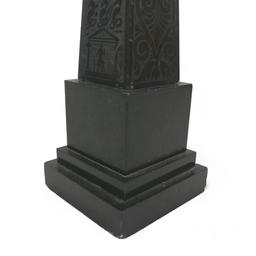 132A - A 19th century slate obelisk, in Grand Tour style, with polished surfaces engraved with foliate and ... 