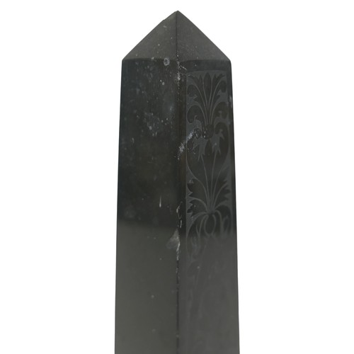 132A - A 19th century slate obelisk, in Grand Tour style, with polished surfaces engraved with foliate and ... 