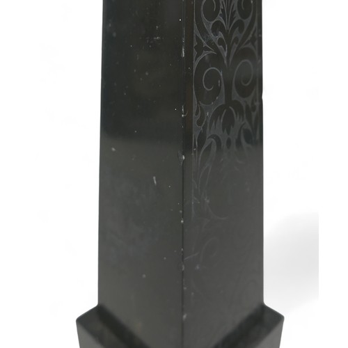 132A - A 19th century slate obelisk, in Grand Tour style, with polished surfaces engraved with foliate and ... 