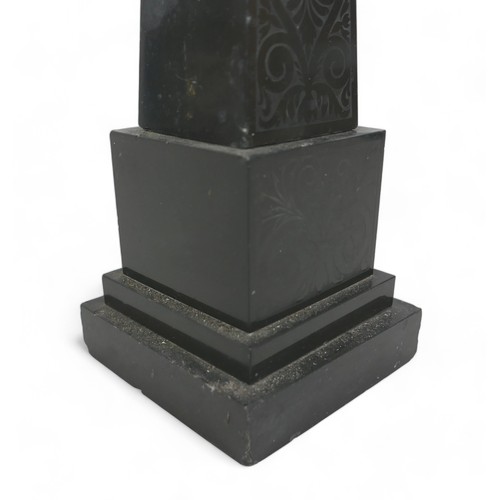 132A - A 19th century slate obelisk, in Grand Tour style, with polished surfaces engraved with foliate and ... 