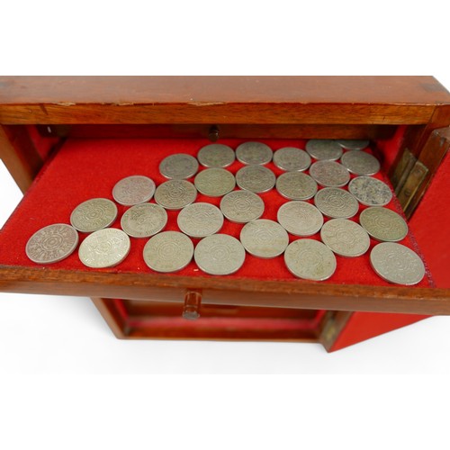 84 - A collection of mainly English coins and other items contained in a nine drawer mahogany collectors ... 