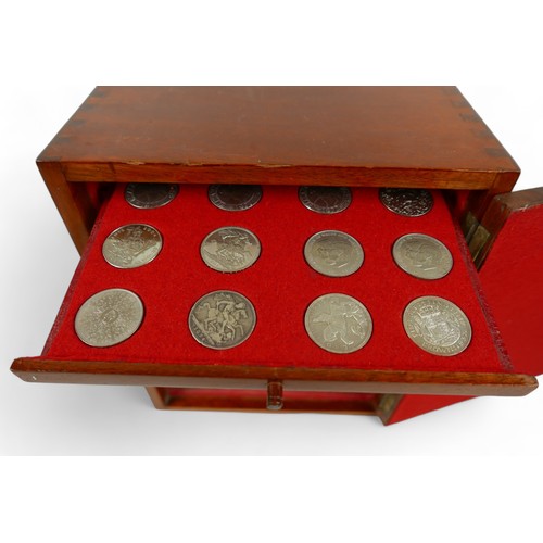 84 - A collection of mainly English coins and other items contained in a nine drawer mahogany collectors ... 