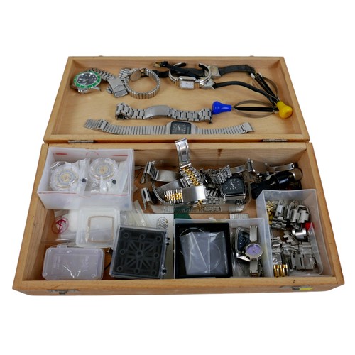 95 - A collection of assorted watch repairing tools, straps, movements, and parts.