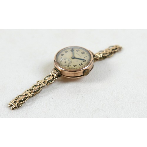 100 - A 9ct yellow gold Rolco lady's wristwatch on a gold plated bracelet strap, 25mm case, 20.0g gross.
N... 