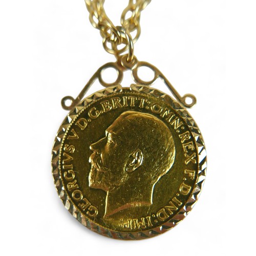 217 - A George V gold sovereign, 1911, in 9ct gold mount, on a 9ct gold chain, total weight 18.7g.