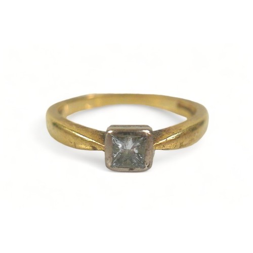 160 - A diamond solitaire ring, the princess cut stone on gold band, size J.