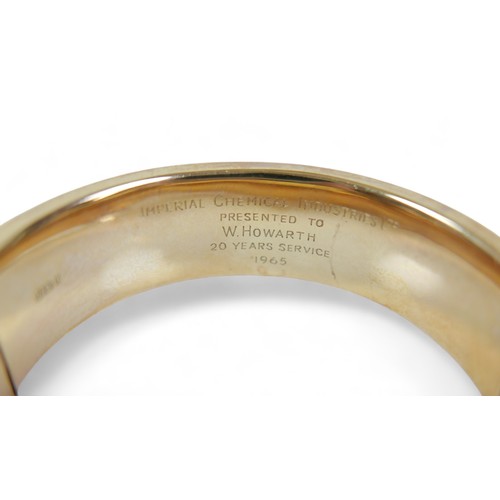 221 - A 9ct yellow gold presentation engraved hinged bangle, 25.1g, 60 by 63 by 19mm external.