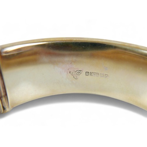 221 - A 9ct yellow gold presentation engraved hinged bangle, 25.1g, 60 by 63 by 19mm external.