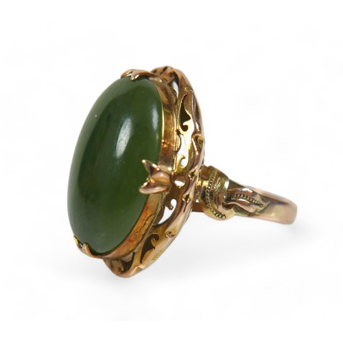 132 - A yellow gold jade ring, size N, head size 24 by 11 by 19mm, 5.9g.