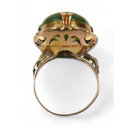 132 - A yellow gold jade ring, size N, head size 24 by 11 by 19mm, 5.9g.