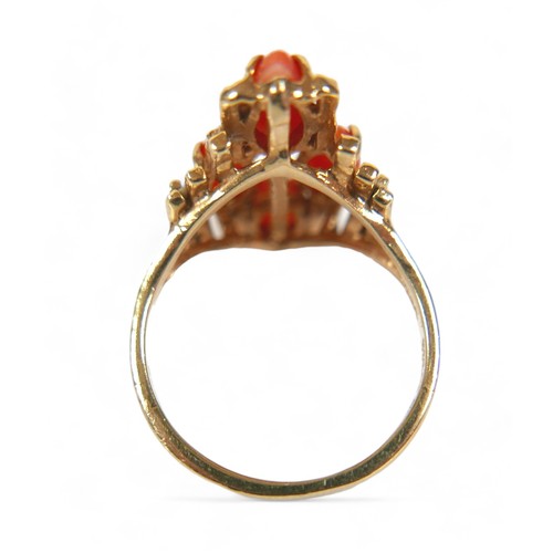 142 - A 14ct yellow gold coral ring, size M, head size 14 by 11 by 22mm, 5.6g