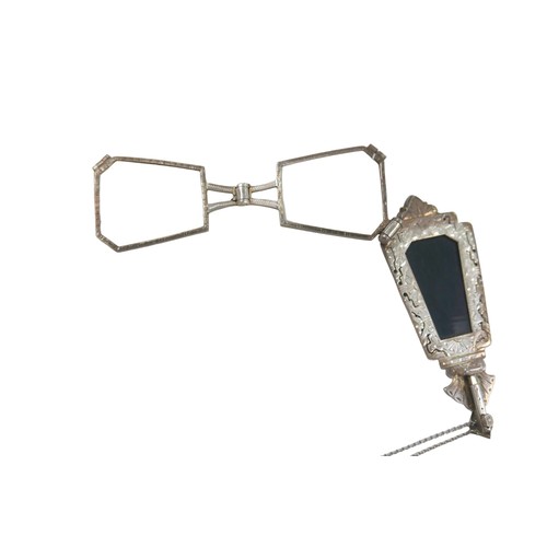 112 - A white metal and dark stone inlaid lorgnette, inset with metal illusion stones with retractable gla... 
