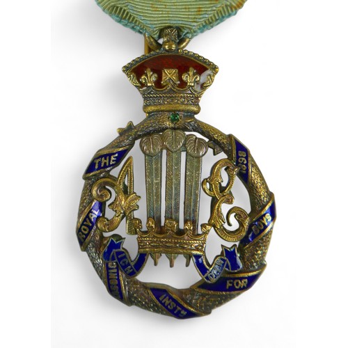 144 - Royal Masonic Institution for Boys, 1892, a gilt-silver and enamel badge by Spencer, London, Prince ... 