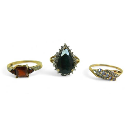 145 - A group of of three 9ct gold dress rings, comprising a pear shaped blue stone ring, 18.57mm at wides... 