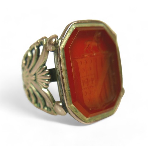 182 - Two Georgian yellow metal fob seals, comprising a Carnelian fob converted into a gents ring, impress... 