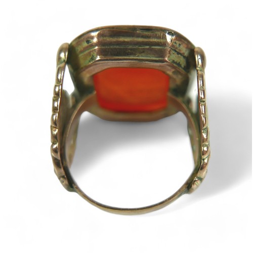 182 - Two Georgian yellow metal fob seals, comprising a Carnelian fob converted into a gents ring, impress... 