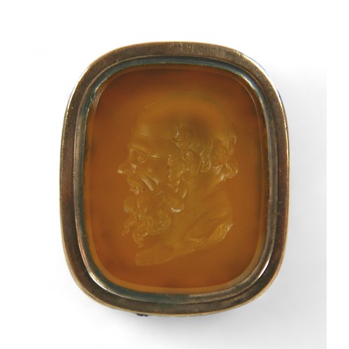 182 - Two Georgian yellow metal fob seals, comprising a Carnelian fob converted into a gents ring, impress... 