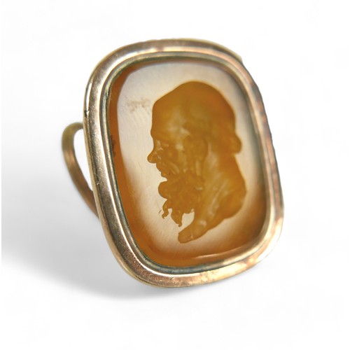 182 - Two Georgian yellow metal fob seals, comprising a Carnelian fob converted into a gents ring, impress... 