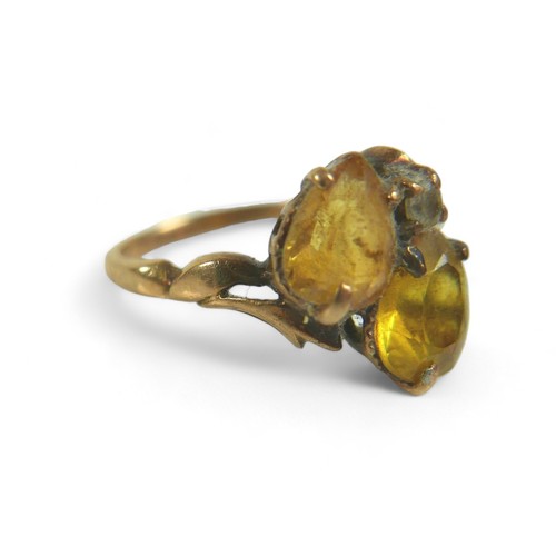 184 - A group of three gold rings, including a 9ct gold ring set with two yellow pear-shaped stones, 2.9g,... 