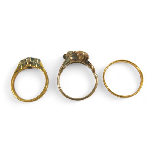 184 - A group of three gold rings, including a 9ct gold ring set with two yellow pear-shaped stones, 2.9g,... 