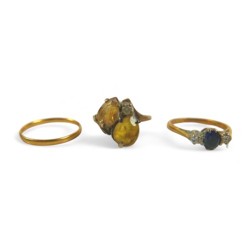 184 - A group of three gold rings, including a 9ct gold ring set with two yellow pear-shaped stones, 2.9g,... 