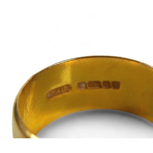 188 - A 22ct yellow gold wedding band, band width 7.7mm, size J/K, 4.5g.