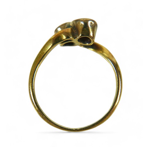 214 - An 18ct yellow gold ring, set with two brilliant cut diamonds, each 3.5mm, 0.17ct, in crossover sett... 