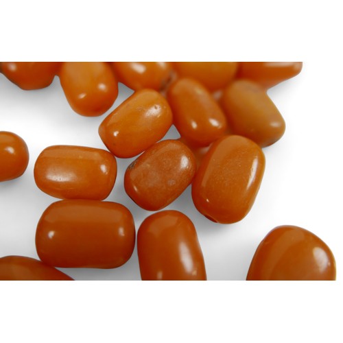 165 - A collection of butterscotch amber oval beads, approx. 35g total, most 16mm long (28 total). (1 bag)