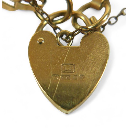 185 - A 9ct gold bar gate bracelet with heart shaped lock and central textured bands, 10.6g.