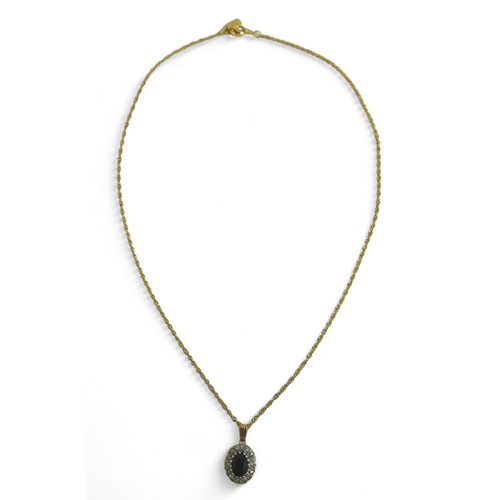 186 - An oval sapphire and diamond flowerhead pendant on gold chain, the chain testing as 9ct, 2.8g, mount... 