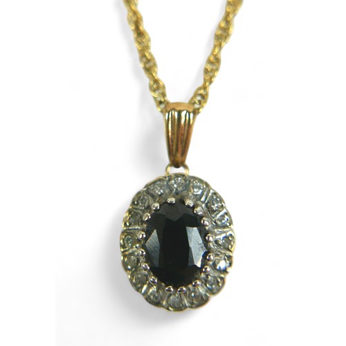 186 - An oval sapphire and diamond flowerhead pendant on gold chain, the chain testing as 9ct, 2.8g, mount... 