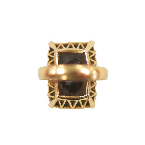 173 - An 18ct gold smoky quartz ring, the rectangular cut stone 16 by 22mm, size n, 11.9g.