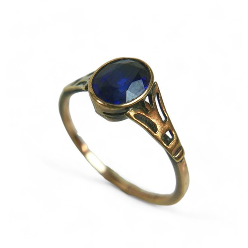 124 - Two 9ct gold ladies dress rings, comprising an Art & Craft style sapphire ring, the stone approximat... 