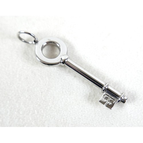 208 - A Theo Fennell 18ct white gold key pendant, 4cm long, 5.3g, together with Theo Fennell box / bag.