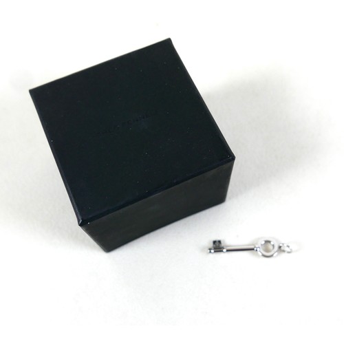 208 - A Theo Fennell 18ct white gold key pendant, 4cm long, 5.3g, together with Theo Fennell box / bag.