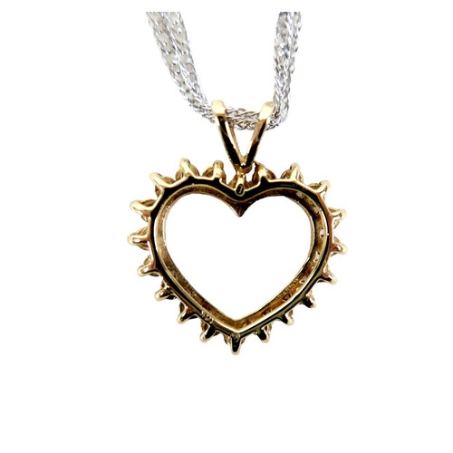 209 - A 15ct gold and diamond heart shaped pendant, set with twenty brilliant cut diamonds, on a 15ct whit... 