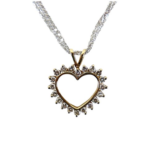 209 - A 15ct gold and diamond heart shaped pendant, set with twenty brilliant cut diamonds, on a 15ct whit... 