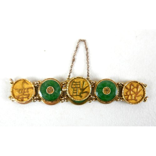 204 - A Chinese 18ct yellow gold and jade set bracelet, formed of circular panels decorated with Chinese c... 