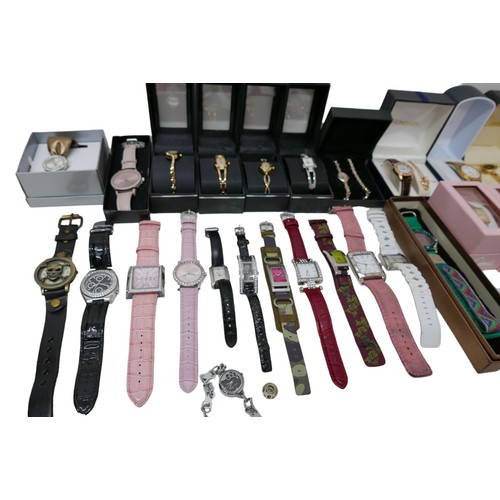 99 - A large collection of modern watches, some in their original boxes, and include Guess and Sekona. (1... 