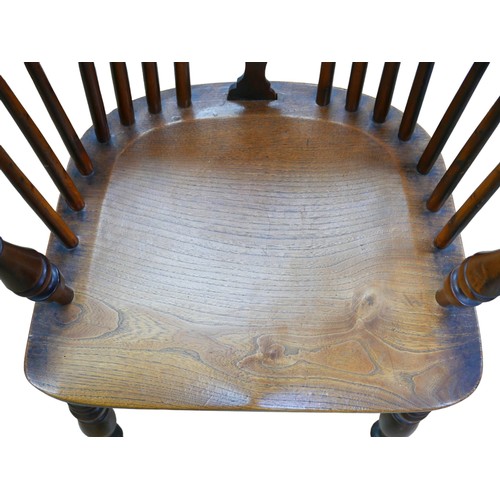 565 - A 19th century yew and elm Windsor chair, pierced back slat, elm seat,  turned legs joined by a crin... 