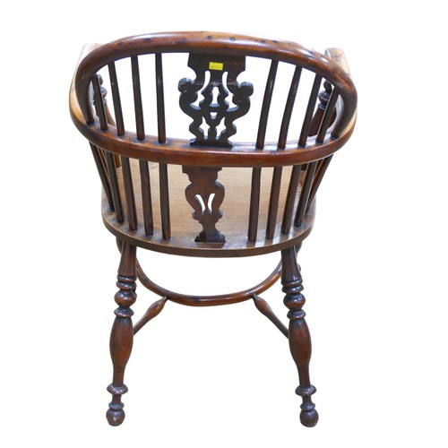 565 - A 19th century yew and elm Windsor chair, pierced back slat, elm seat,  turned legs joined by a crin... 