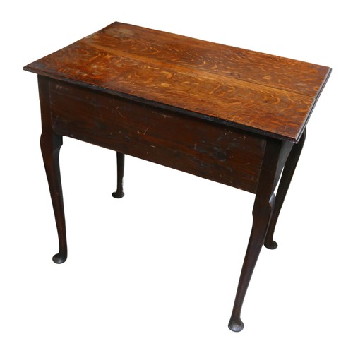 558 - A 19th century oak low boy, with three drawers above a shaped apron, cabriole legs with pad feet, 71... 