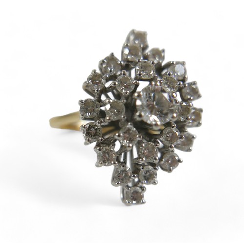 92 - An 18ct yellow and white gold diamond cluster ring, set with a central brilliant cut diamond approxi... 