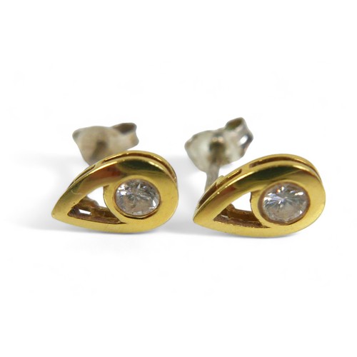 67 - A pair of diamond earrings, each with a single round cut stone  approximately 3mm diameter, in unmar... 