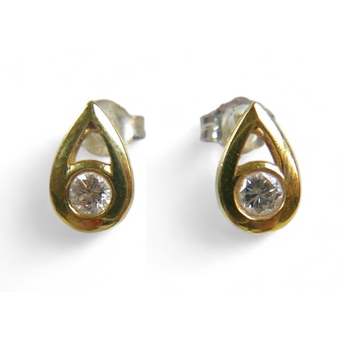 67 - A pair of diamond earrings, each with a single round cut stone  approximately 3mm diameter, in unmar... 